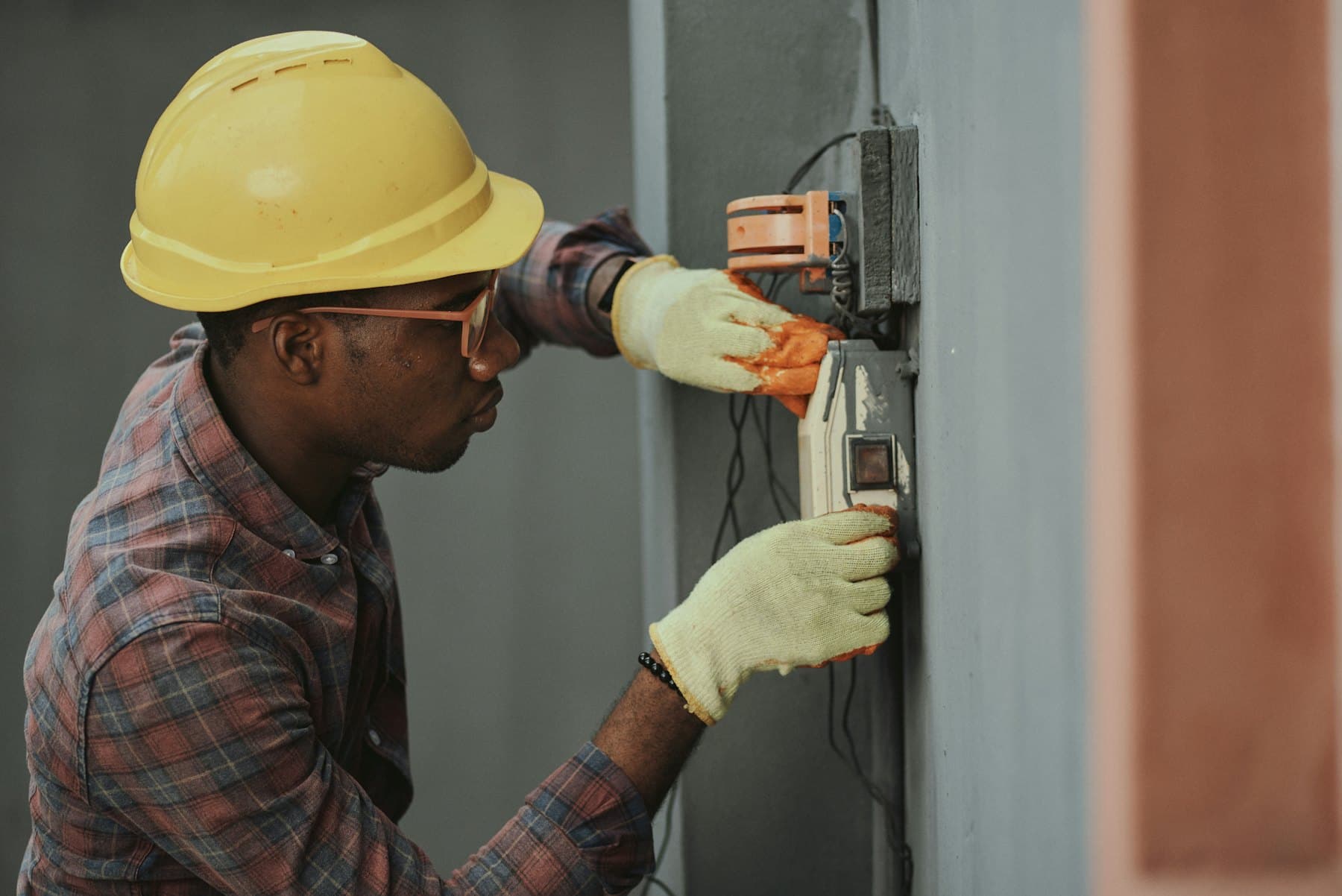 Electrician terminating cables in a distribution board